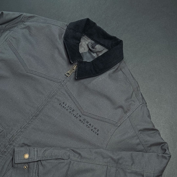 Dark gray denim work jacket with black corduroy collar and embroidered alice in chains text on chest