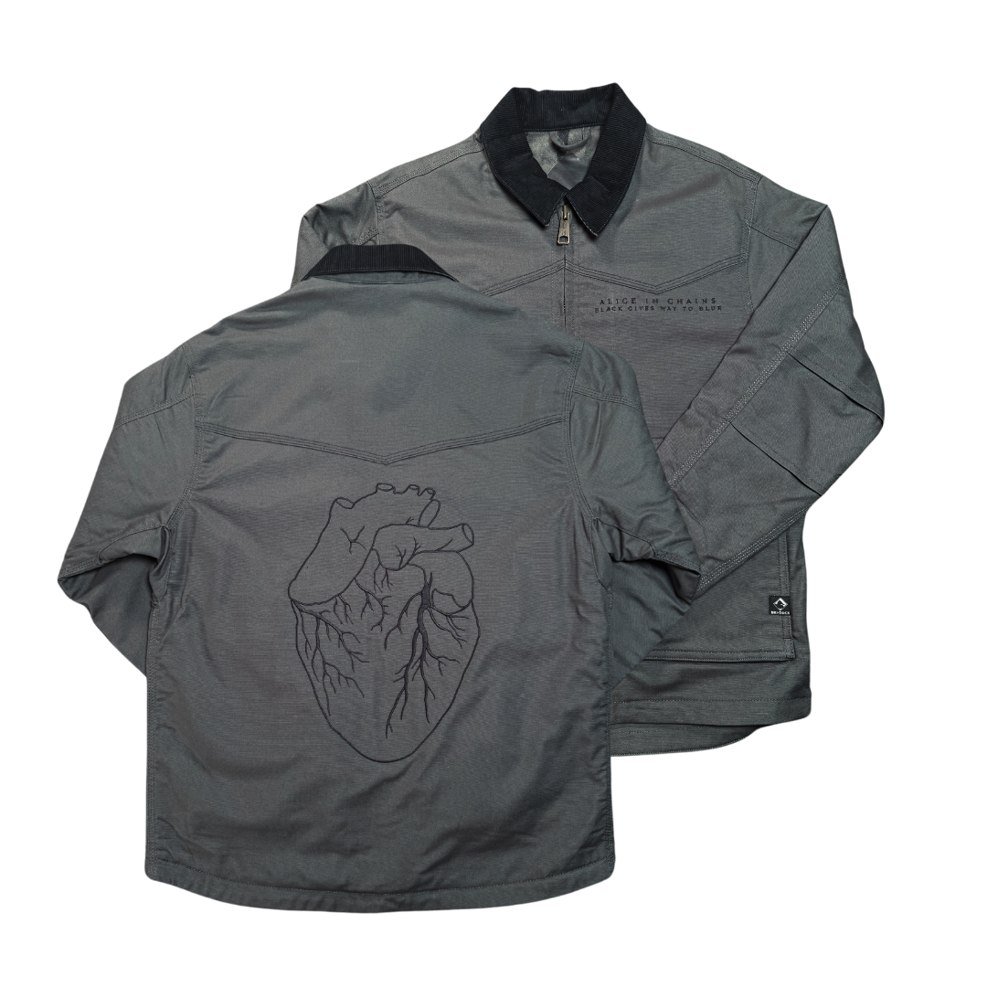 Gray work jacket with black-lined collar and front zipper showing embroidered anatomical heart on the back