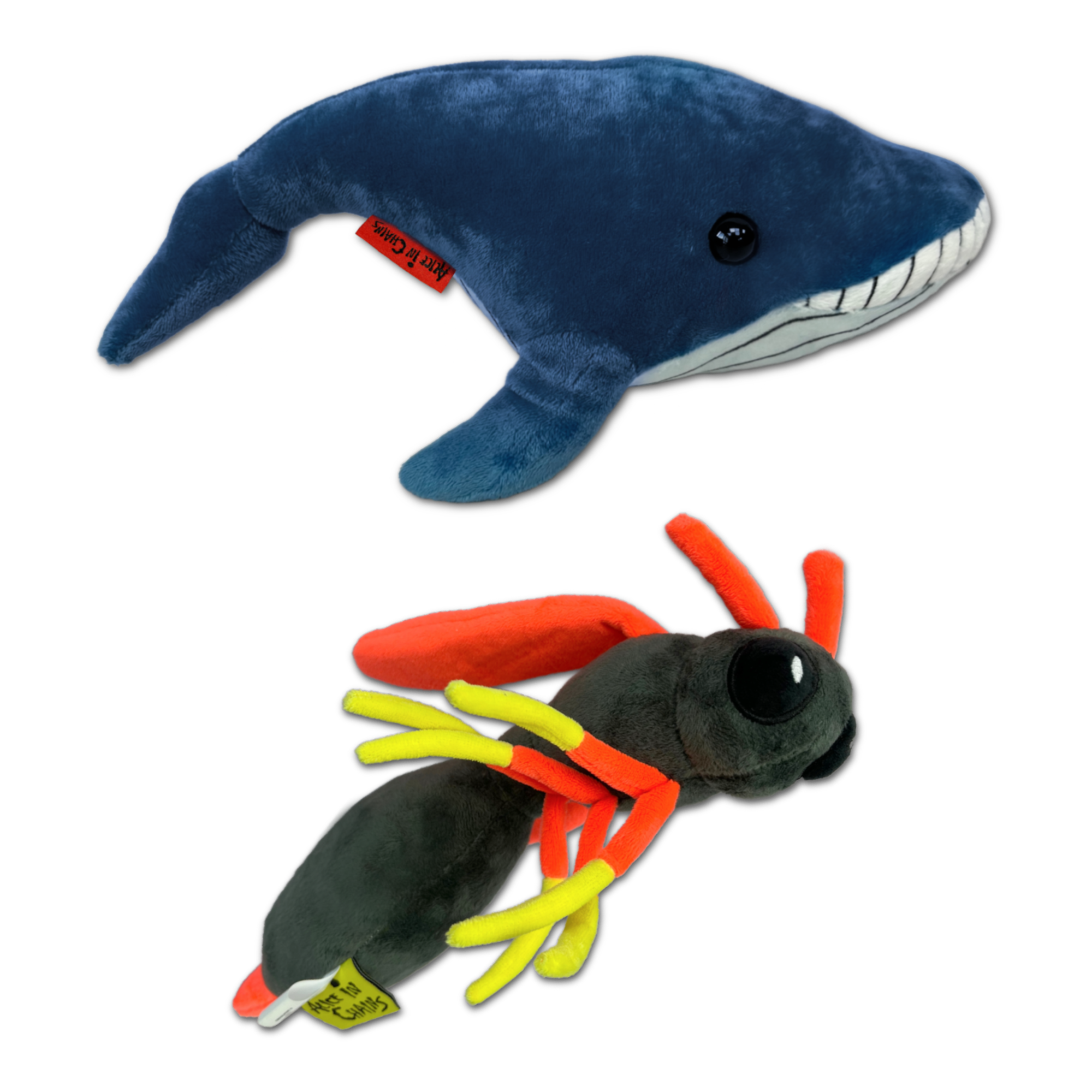 Blue plush whale toy with a smiling expression.