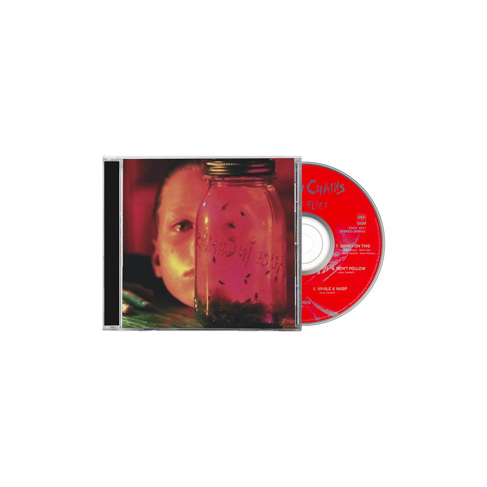 CD album cover featuring a glass jar with a face partially visible behind it.