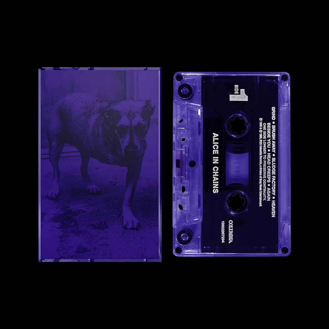 Transparent purple cassette tape with black label and matching transparent case featuring a dog image in violet tones.