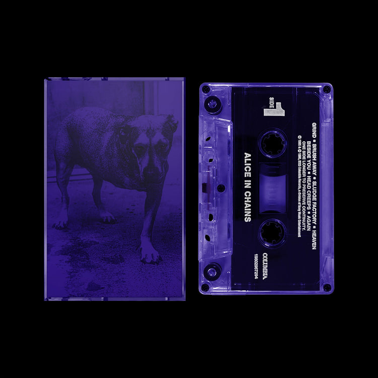 Transparent purple cassette tape with black label and matching transparent case featuring a dog image in violet tones.