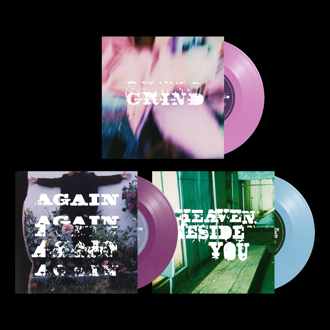 Pink and light blue translucent vinyl records with matching album art covers.